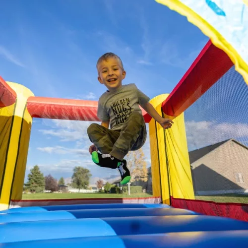 HappyHop Hüpfburg mit Rutsche Dinosaurier